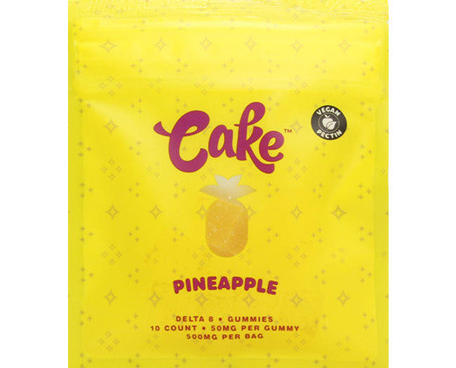 Yellow packaging of Cake Delta 8 Gummies with pineapple flavor, featuring 10 count, 50mg per gummy, totaling 500mg per bag. Brand logo and pineapple icon visible on bright yellow background.