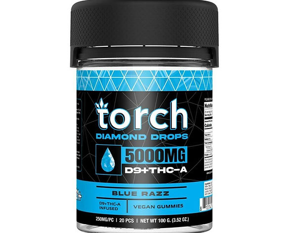 Black jar of Torch Diamond Drops THCa Gummies 5000mg, blue and white label featuring diamond pattern and droplet icon. Product name and strength prominently displayed. Flavor: Blue Razz. Vegan gummies, 20 pieces per container.