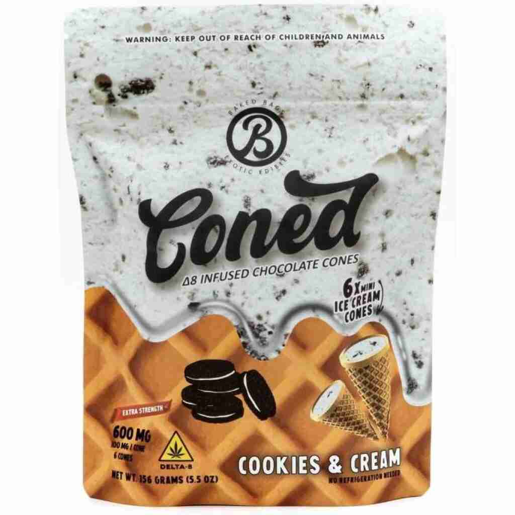 Package of Baked Bags Coned D8 Ice Cream Cones, featuring Cookies & Cream flavor. Displays 600mg Delta-8 content, ice cream cone and cookie images on a waffle-textured background. Includes warning label and brand logo.